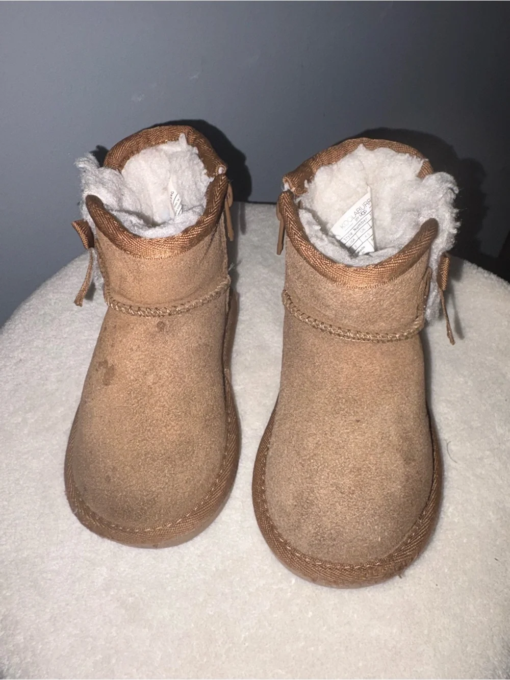Pair of Cozy Suede toddler boots in Chestnut kookaburra by Ugg and Black sued